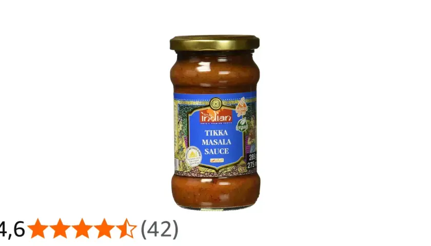 Glas mit würziger Tikka Masala Sauce, vegan und glutenfrei, bereit für ein authentisches indisches Gericht.