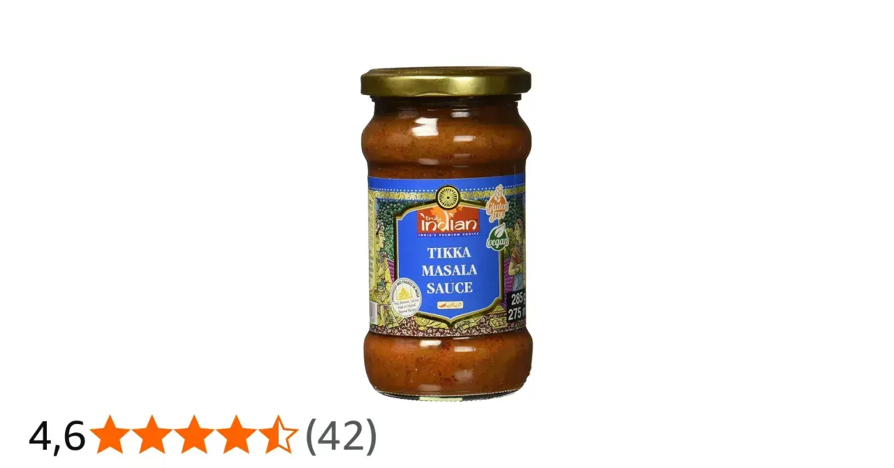 Glas mit würziger Tikka Masala Sauce, vegan und glutenfrei, bereit für ein authentisches indisches Gericht.